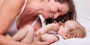 mum and baby laughing together
