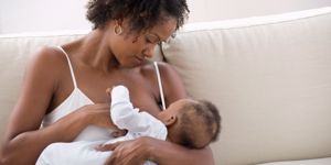 mom breastfeeding newborn baby