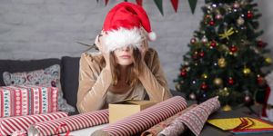 depressed-frustrated-woman-wrapping-christmas-gift-boxes-winter-picture-id1288724003.jpg