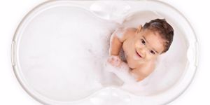 baby in white bubble bath
