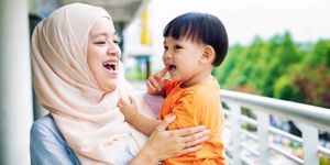 muslim-mother-laughing-with-young-son-picture-id970424376.jpg