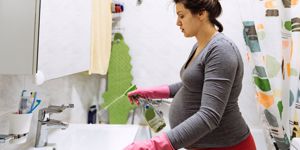 pregnant mom cleaning bathroom