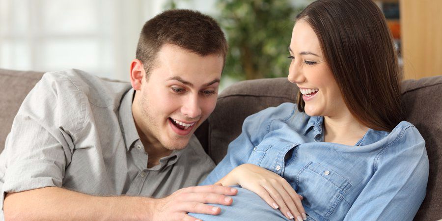partner feeling baby kick inside womb