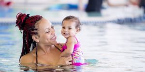 mum and baby smiling in swimming pool