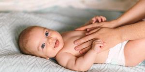 massage-for-the-baby-four-month-old-baby-smiling-doing-gymnastics-picture-id1179665363.jpg