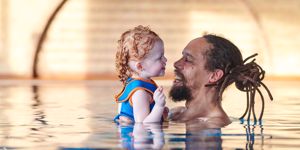 Father and child swimming