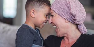 woman-with-cancer-spends-precious-time-with-her-playful-son-picture-id1175131321.jpg