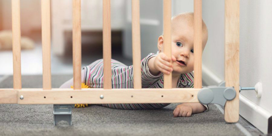 baby behind safety gate