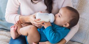 infant-drinking-milk-picture-id696311656.jpg