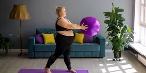 pregnant woman exercising with birth ball