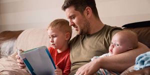 father-and-son-reading-a-book-picture-id1051328308.jpg