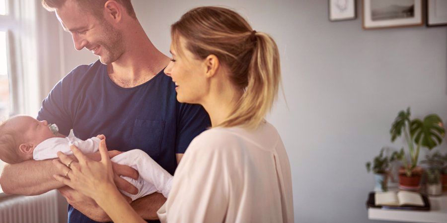 parents with newborn baby