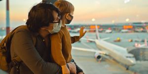 family-in-protective-face-masks-in-airport-during-covid19-pandemic-picture-id1284745836.jpg