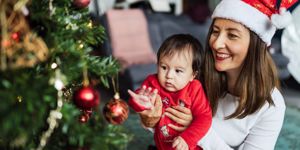 young-woman-and-her-baby-celebration-their-first-christmas-together-picture-id1287162084.jpg