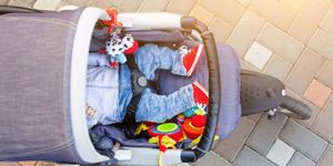 baby-sleeping-threewheel-stroller-outdoor-child-in-bright-casual-at-picture-id995122606.jpg