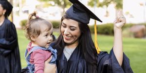 young mum graduating holding her baby