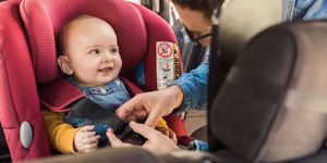baby smiling in car seat