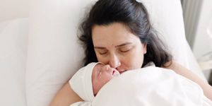 new-born-baby-with-his-mother-picture-id1217040124.jpg