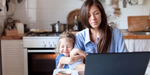 working-from-home-with-kid-happy-daughter-hugging-mother-young-woman-picture-id1213490744.jpg