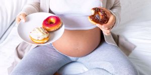 pregnant mom eating donuts