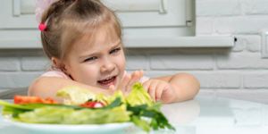 the-child-refuses-vegetables-picture-id1226744718.jpg