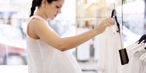 pregnant woman shopping for maternity clothes