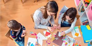 preschool-teacher-with-kids-having-creative-activities-picture-id639271192.jpg